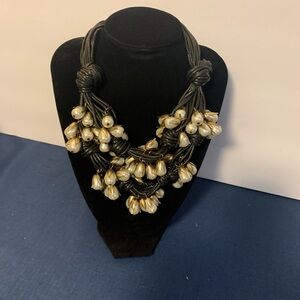 Braided and tied pearl statement necklace
